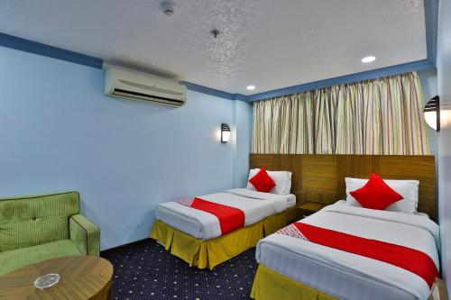 Cama ou camas em um quarto em Khobar Palace Hotel