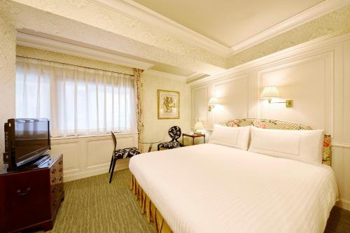 Televiisor ja/või meelelahutuskeskus majutusasutuses Art Hotel Kokura New Tagawa