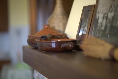 three brown bowls sitting on a wooden table at Fattoria Capobianco in Montefiascone