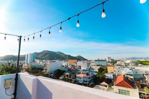 a view of a city from a balcony with lights at Sea Star Hotel Quy Nhon in Quy Nhon