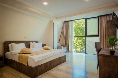 Postel nebo postele na pokoji v ubytování Hotel Comfort Tbilisi