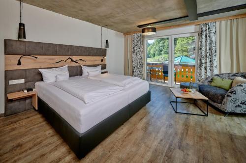 En eller flere senge i et værelse på Landhotel Moorhof