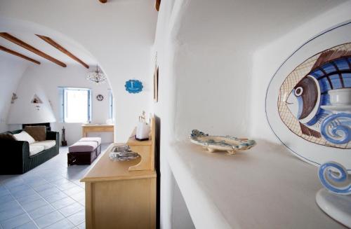 a living room with a couch and a table in a room at Casa Elisa Lipari in Lipari