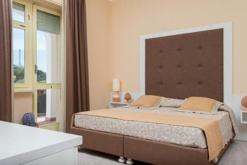 Approdo Boutique Hotel Leucaにあるベッド