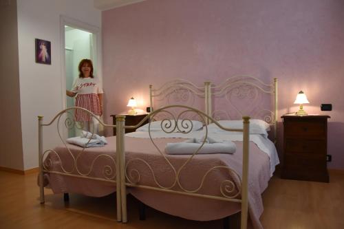 Un pat sau paturi într-o cameră la Il Ciclamino Bed and Breakfast