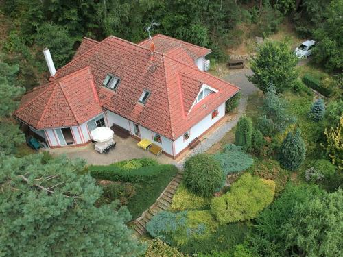 an aerial view of a house with an orange roof at Comfortable detached house with large garden in Klokočí