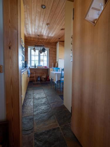 a hallway with a kitchen and a dining room at Villa Lohusalo I with Sauna in Lohusalu