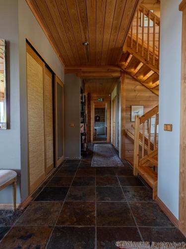 a hallway of a house with a wooden ceiling at Villa Lohusalo I with Sauna in Lohusalu