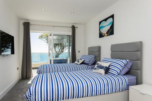 Cama o camas de una habitación en Ocean Blue