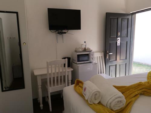 Sinesan Guesthouseにあるベッド
