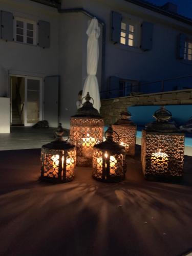 a group of lights in front of a building at Exceptional 5 Star villa with breathtaking views, Sauna and fitness studio in Momjan