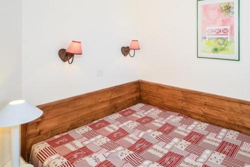 Postel nebo postele na pokoji v ubytování Residences Quartier Falaise - maeva Home