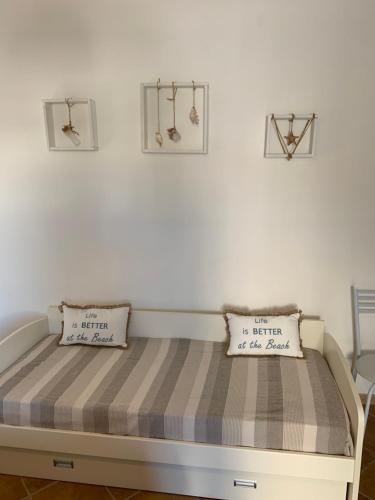Ένα ή περισσότερα κρεβάτια σε δωμάτιο στο Nonna Pina