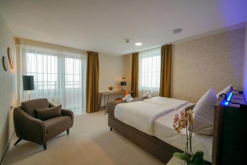 Postel nebo postele na pokoji v ubytování Grand Hotel BELLEVUE