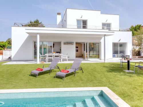 a villa with a swimming pool and a house at Holiday Home Almendro by Interhome in Santa Cristina d'Aro