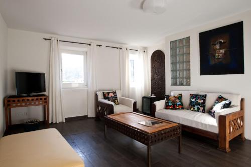 TV a/nebo společenská místnost v ubytování Guesthouse Arosio B&B