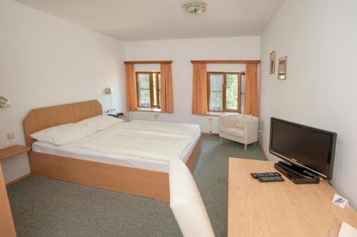 Postel nebo postele na pokoji v ubytování Pension Poschmühle