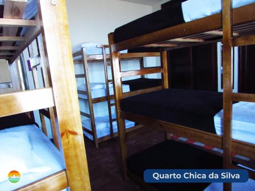 a group of bunk beds in a dorm room at Buena Vista Hostel in Ouro Preto