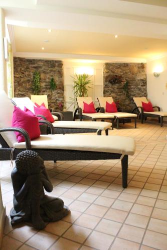 a room with couches and couches in a room at Andi's Skihotel in Obertauern