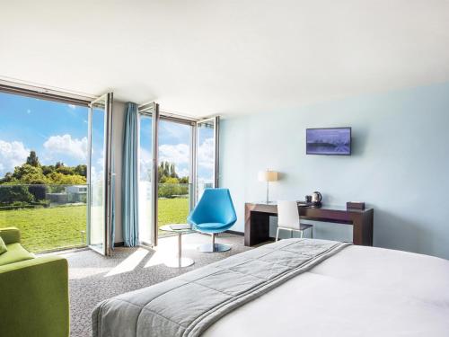 מיטה או מיטות בחדר ב-Starling Hotel Lausanne