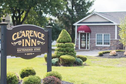 a sign for aance inn in front of a house at Clarence Inn Extended Stay in Clarence Center