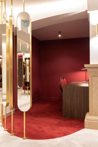 a dressing room with a table and a mirror at Le Palace De Menthon in Menthon-Saint-Bernard