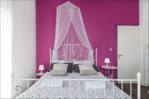 Un pat sau paturi într-o cameră la Casa Rocca d'Api