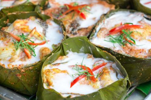 a plate of food with peppers on top at Malakati Village Beach House in Nacula Island