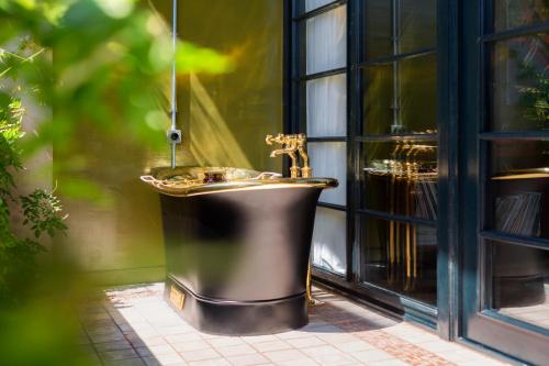 a bathroom with a sink in a window at Stamba Hotel in Tbilisi City