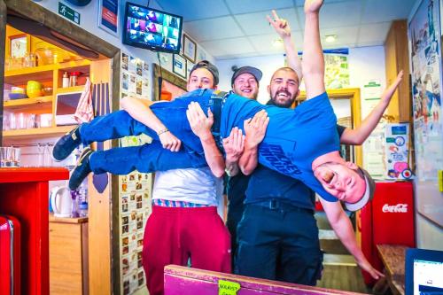 a group of people are posing for a picture at Naughty Squirrel Backpackers Hostel in Rīga