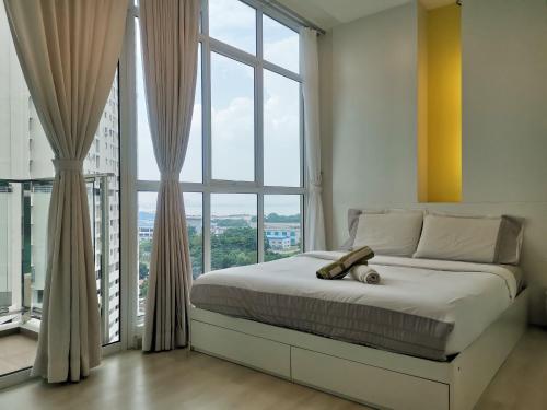 a bedroom with a bed and a large window at Strait Garden Studio X Ace Pro @ George Town in George Town