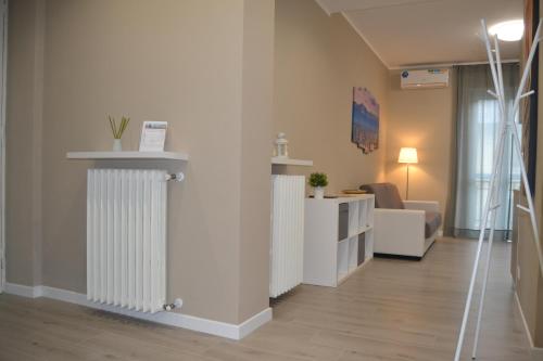 a living room with two radiators on a wall at DOMUS LINGOTTO in Turin