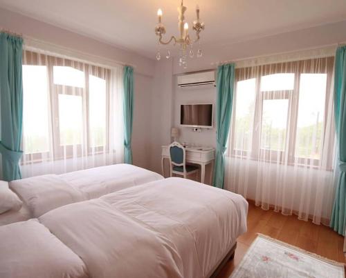 Postel nebo postele na pokoji v ubytování Hayat Oksijen Resort