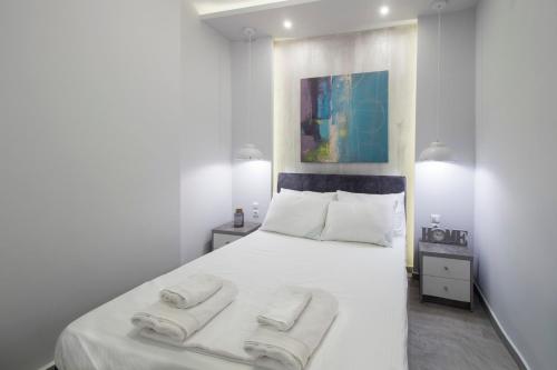 Postel nebo postele na pokoji v ubytování FLOW - White Tower Two Bedroom Suite