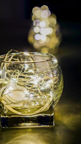 a glass bowl of white wine sitting on a table at YAB-GuestHouse, FemaleOnly, ForeignOnly in Seoul