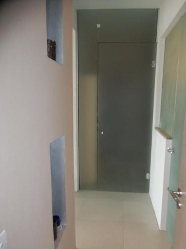 an empty hallway with a door in a room at Beach Villa Pantheon in Pomos
