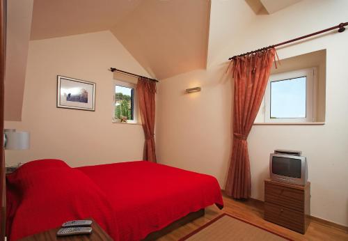 Ένα ή περισσότερα κρεβάτια σε δωμάτιο στο Vila Marija