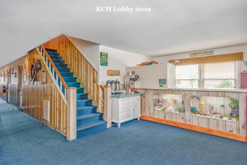 a room with a staircase in a house at King Charles Hotel in Ocean City