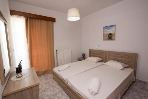 Posteľ alebo postele v izbe v ubytovaní KOS Family House