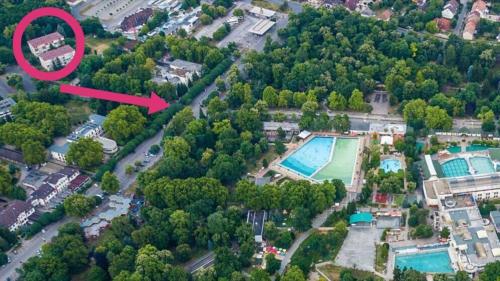 an aerial view of a house with a pool at Central Platinum Apartman Harkány in Harkány