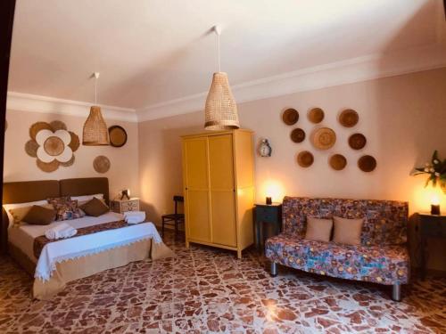 Postel nebo postele na pokoji v ubytování “La Rampa” Affitti Brevi - Racalmuto (AG) Sicilia