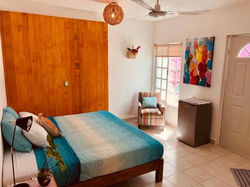 Postel nebo postele na pokoji v ubytování Casa Alberto Cozumel