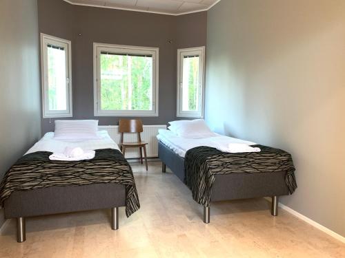 Кровать или кровати в номере Villa Ateljeerinne