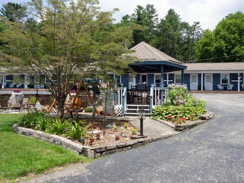 a garden in front of a house at Blowing Rock Inn in Blowing Rock