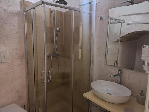 a bathroom with a shower and a sink at B & B San Giovanni 9 in Gallipoli