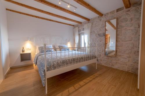 Un ou plusieurs lits dans un hébergement de l'établissement Villa Castellum Canalis