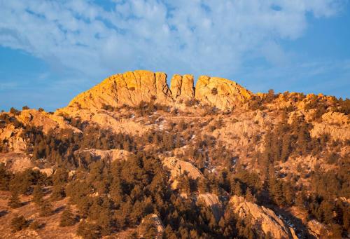 a rock formation on a mountain with trees at Italian Style in Old Town with Private Hot Tub in Fort Collins