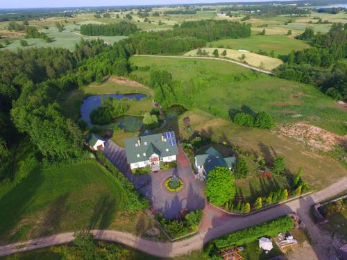an aerial view of a large house on a hill at Jaś i Małgosia nad Jeziorem Wigry in Rosochaty Róg