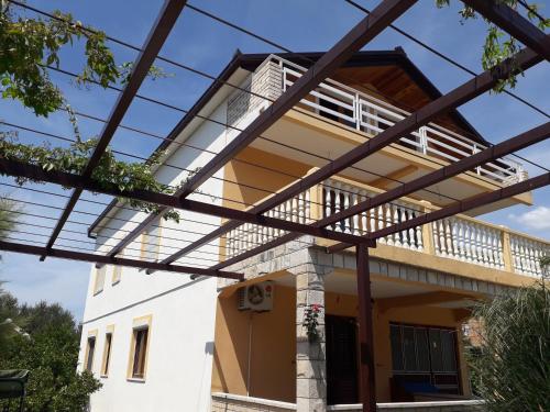 an external view of a house with a balcony at Apartmani Sara Trebinje in Trebinje