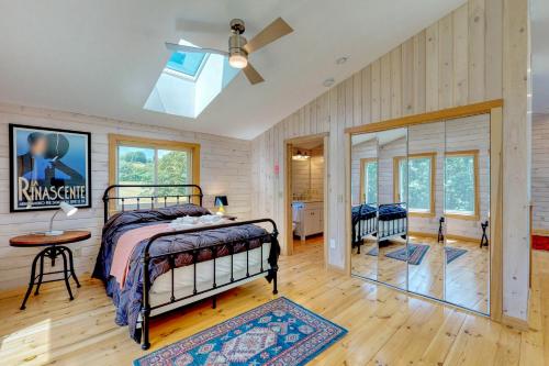 a bedroom with a bed and a ceiling fan at Eagles View 2 in Bowdoinham